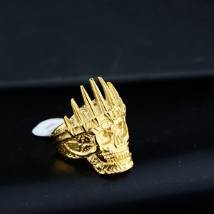 Detailed close-up of a gold crown skull ring made of durable stainless steel