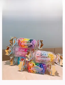 Detail of candy-shaped boxes filled with colorful high-elastic hair bands for children