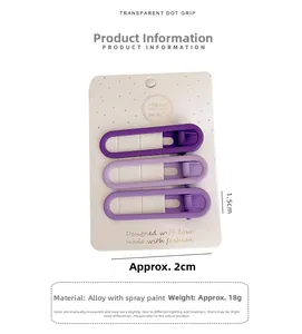 Close-up of three purple gradient matte alloy hair clips on a textured white card