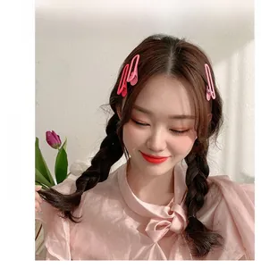 Close-up of three pink gradient alloy hair clips styled on model for hair decoration