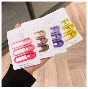 Colorful matte alloy duckbill hair clip set with pastel gradient tones on display cards