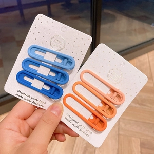 Set of matte gradient alloy duckbill hair clips in blue and pink on handmade card