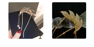 Detailed close-up of golden leaf U-shaped hair pin with rhinestones and pearl tassels