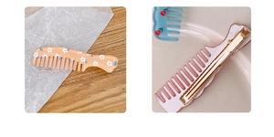 Detail showing creative comb-shaped hair clip with floral pattern and gold duckbill clip