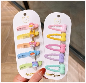 Close-up of 10-piece colorful cartoon animal and soap bow hair clips set for girls