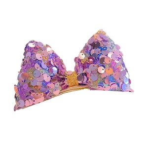 Sparkling purple sequin bow hair clip with gold glitter center for little girls