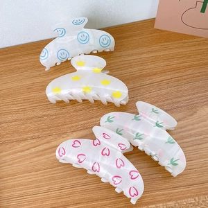 Set of 4 marble acrylic hair claw clips with colorful smiley and floral prints