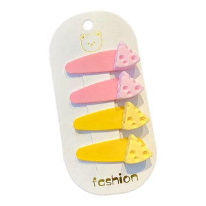 Cute fruit and cheese themed hair clips for girls set on a white display card