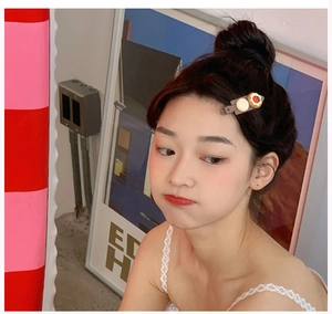 Detail of sweet hair clip with strawberry biscuit and cream donut resin accessories
