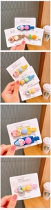 Detailed view of colorful resin dessert hair clips including ice cream and donuts