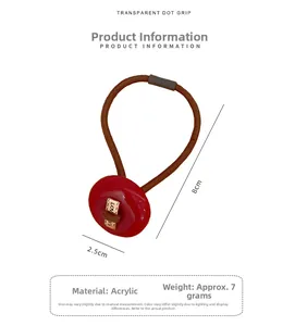 Detail of high elastic hair tie with red acrylic button showing 2.5cm diameter size