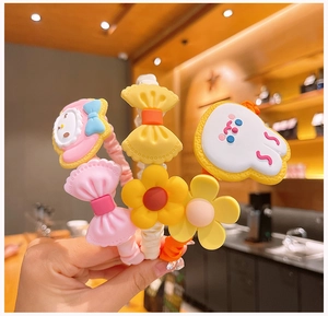 Close-up of colorful floral hairbands with cute cartoon characters for girls