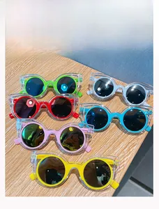 Detailed collection of colorful cat-eye kids sunglasses with layered frame design