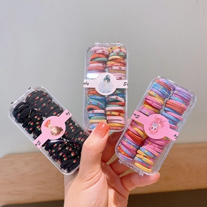 Lot de trois boîtes d'élastiques cheveux pour enfants à motifs fraise et rayures