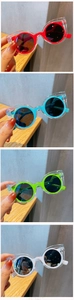 Detail view of stylish kids polarized sunglasses in translucent red blue green and white colors