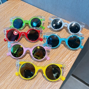 Kids polarized sunglasses set with cat-eye frames in six vibrant colors on wood