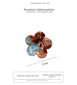 Detail view of 2.6cm acetate flower hair claw clip with blue and brown marble texture