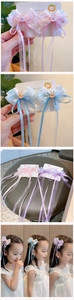 Close-up of chiffon ribbon hair bow with long flowing tassels for girls' traditional costume