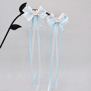 Light blue bow hair clips for girls with long tassels and cute rabbit ornaments