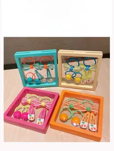 Detailed set of colorful children's hair clips and bow ties in acrylic gift frames