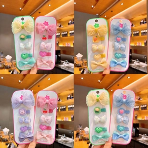 Set di fermagli per capelli colorati per bambine con fiocchi e ciondoli in resina