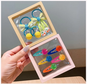 Colorful acrylic hair clips and elastic ties for kids in protective PE film boxes