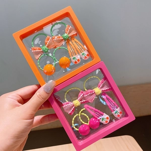 Cute children's pink and orange hair accessory set with bows and cherry clips