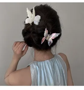 Graceful acetate butterfly hair claw clip shown in a stylish half-up hairstyle