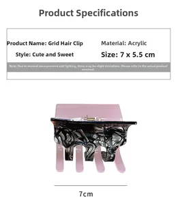 Detail view of a 7x5.5cm pink and marble acrylic hair claw clip with size dimensions