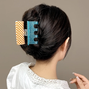 Pink and green acetate hair claw clip with checkerboard and glitter pattern for women