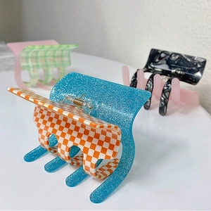 Assorted acetate square hair claws in colorful checkered and marble patterns for women