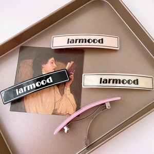 French vintage acetate letter hair clips in black, cream, beige, and pink colors