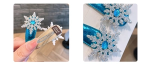 Detail of handmade ice blue snowflake hair clip with glitter PU leather and gem