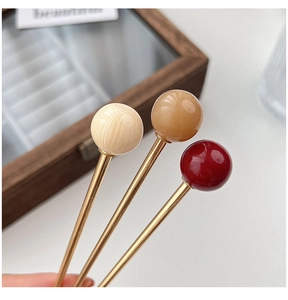 Detailed view of coffee brown faux glass bead hair pins in three elegant colors