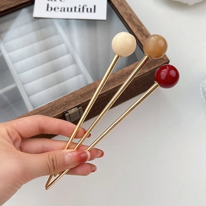 Three elegant French style hair pins with amber and marble beads in a gold metal finish
