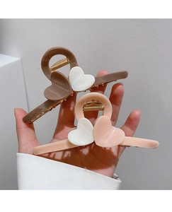 Detailed view of milk tea heart hair claws made of high-quality polished acrylic material
