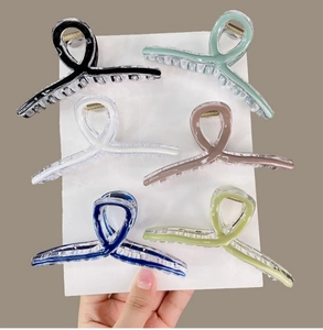 Set of six colorful translucent jelly hair claws in minimalist cross design for women