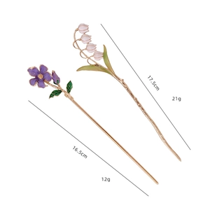 Detailed view of handmade lily of the valley hair pins with size and weight measurements