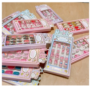 Close-up of 24pcs colorful cartoon nail stickers with pink hearts and cute rabbit designs