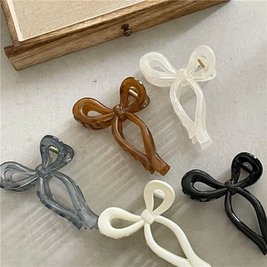 Bow-shaped jelly acrylic hair claws in assorted colors for high ponytail hairstyles