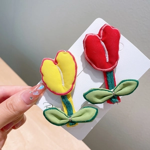 Handmade embroidered tulip hair clips set in yellow and red floral design for girls