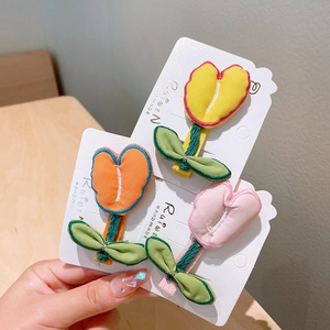Handmade fabric tulip hair clips set in yellow, orange, and pink for girls