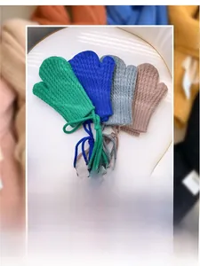 Detail view of colorful corn texture knit mittens for kids with anti-lost neck straps