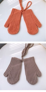 Detailed knit texture of orange and coffee winter neck-hanging gloves for kids