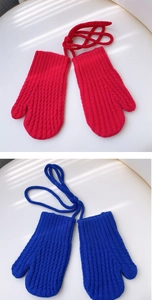 Close-up of knit texture and anti-loss neck cord on red and blue winter mittens