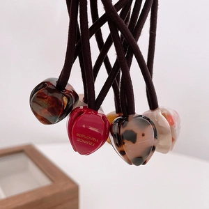 Elegant tulip bud acetate hair ties with tortoise and marble patterns for high ponytails