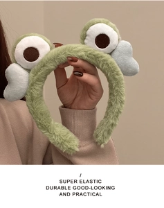 Detail of soft green plush frog headband with super elastic band and cloud accents