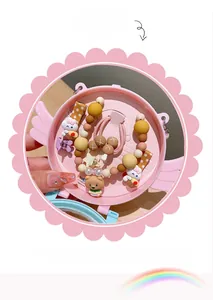 Detail view of pink angel gift box with anti-slip cartoon hair clips and elastic hair ties