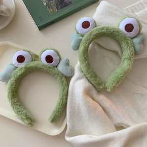 Green plush headband with cartoon big eyes and wings for face washing and makeup