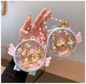 Close-up of angel themed gift box showing colorful hair accessories for little girls